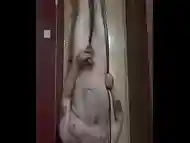 bisexual amateur male hung by his ankles upside down naked in the air by a one ton hoist masturbates and shoots a cumshot on his face belly and floor