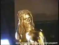 Golden painted Renata showing pussy