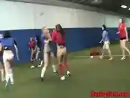 College teens pusslick on football field