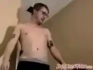 Cute amateur Jack with glasses masturbates on a leather sofa