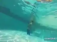 Hot brunette slut Candy swims underwater