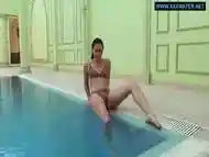 Kittina swims naked in the swimming pool