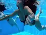 Sexy babes with big tits swim underwater in the pool